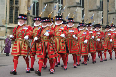 The Yeomen Warders of Her Majesty's Royal Palace and Fortress the Tower of London, and Members of the Sovereign's Body Guard of the Yeoman Guard Extraordinary, popularly known as the Beefeaters, are ceremonial guardians of the Tower of London. The name Beefeater is more likely to have originated from the time when the Yeomen Warders at the Tower were paid part of their salary with chunks of beef.